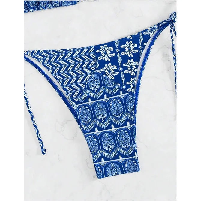 Women's green split bandage bikini with printed stitching on a mannequin.