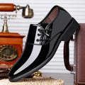 Men's black and brown formal business shoes with a square heel and round toe on a rubber sole.