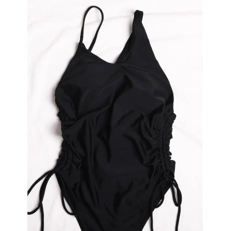 Black sleeveless bodycon dress with lacing and sloping shoulder, tight fit, 70-80cm length, sizes S-XL.