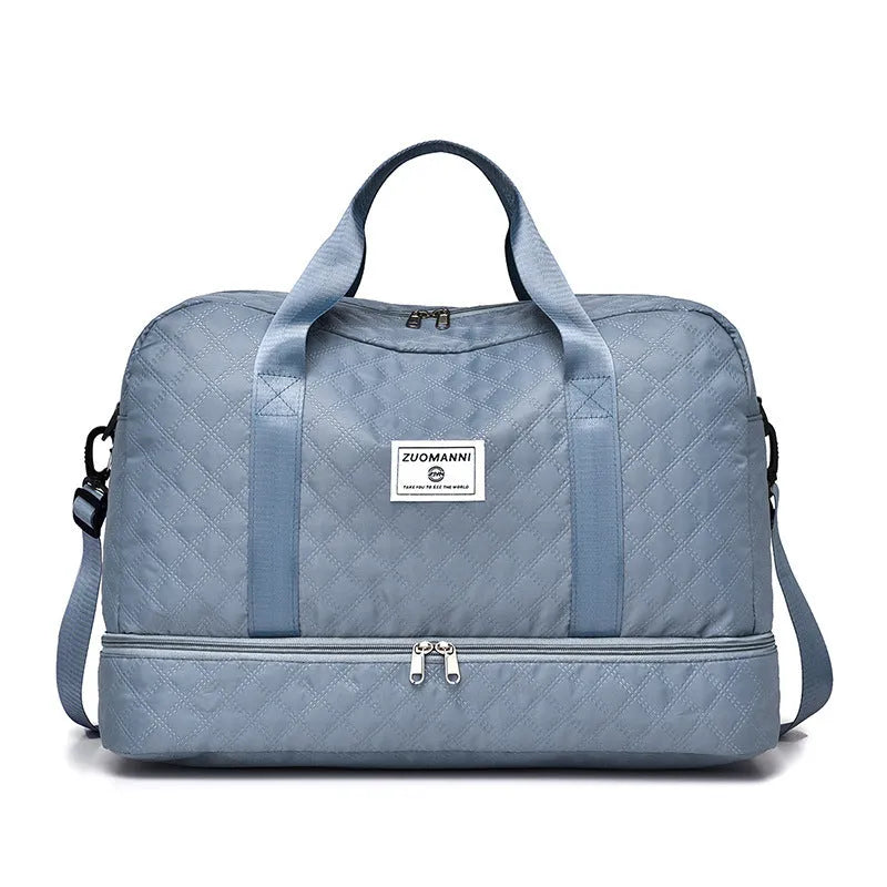Large Oxford cloth travel bag in a solid colour showing its spacious design and street style details.