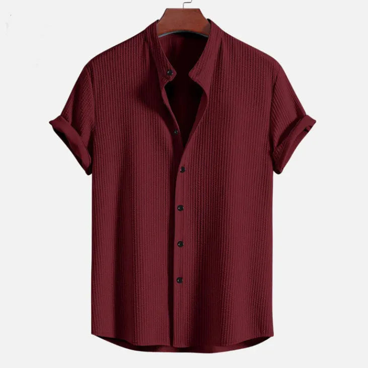 Men's loose fit short sleeve casual shirt in a solid colour on a hanger