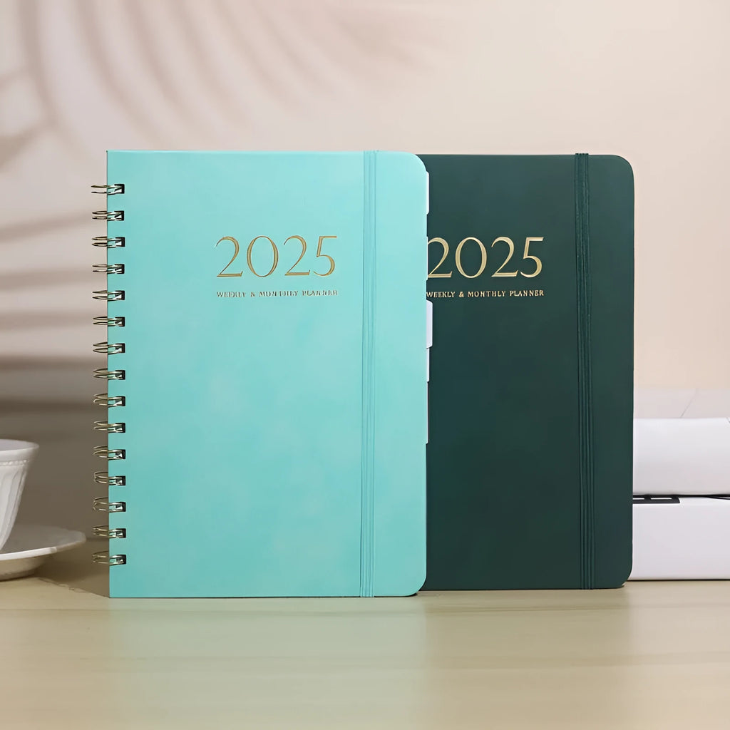 A5 leather notebook with metal coil binding in multiple colour options including black, blue, brown and green