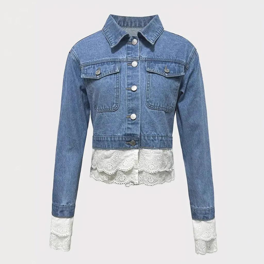 Blue women's denim jacket with lace stitching detail, shown on a hanger.