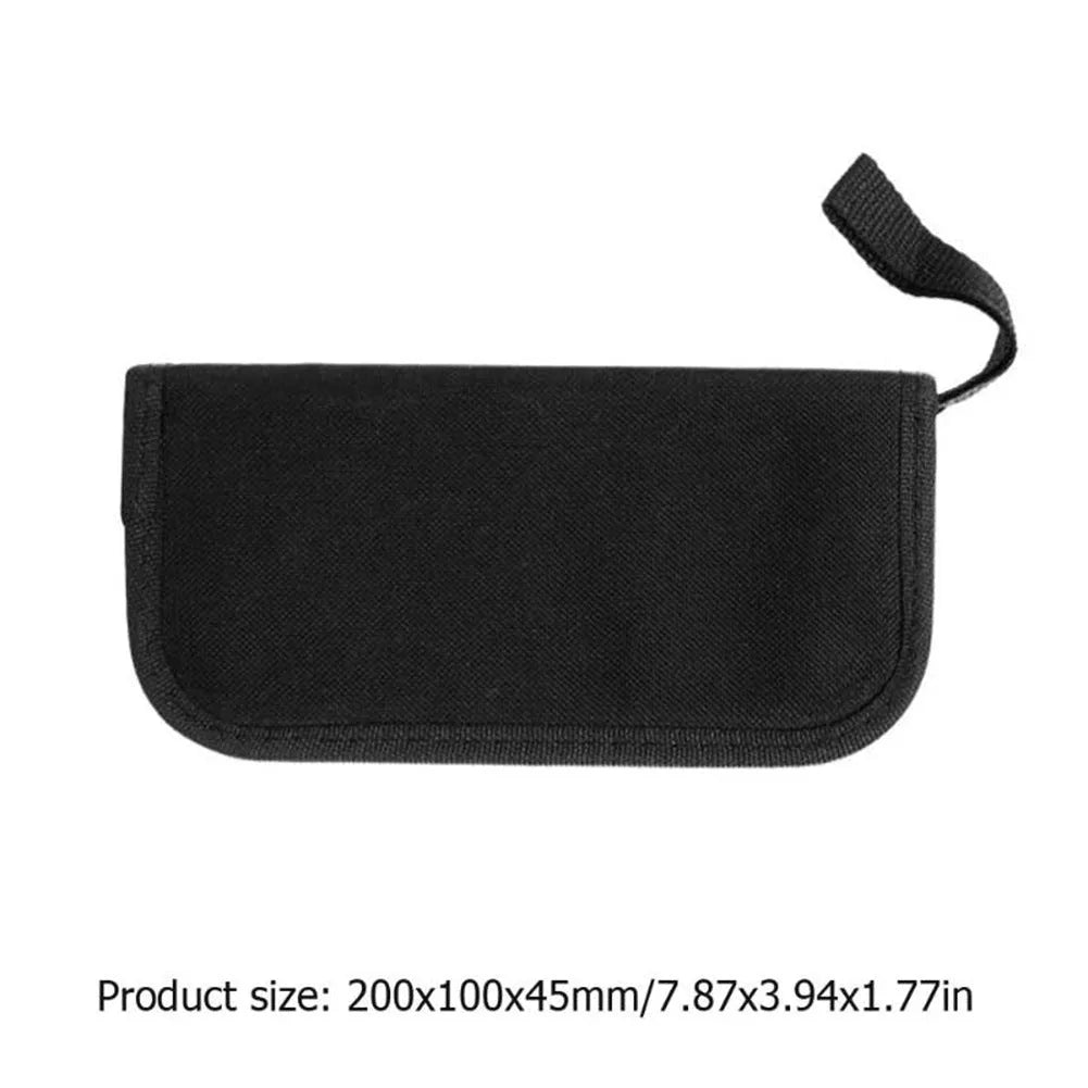 Open black guitar repair kit showing truss rod wrench, string action ruler, and cleaning tools in moulded plastic case