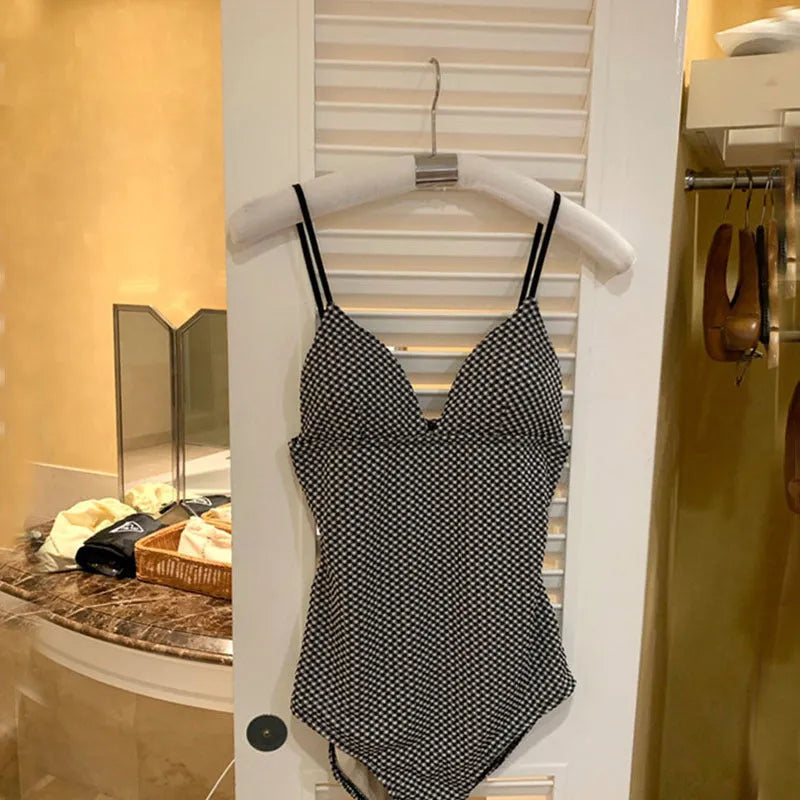 Blue one-piece swimsuit for women designed for belly and chest coverage.