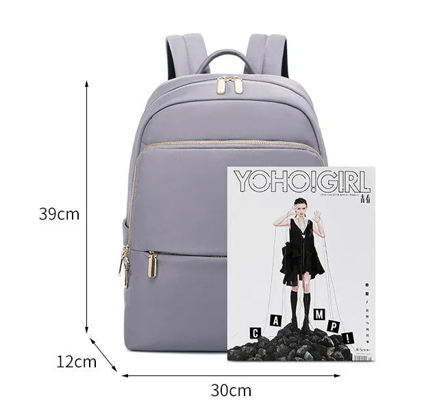 Women's large Oxford cloth backpack in black, showing front compartment and breathable back panel