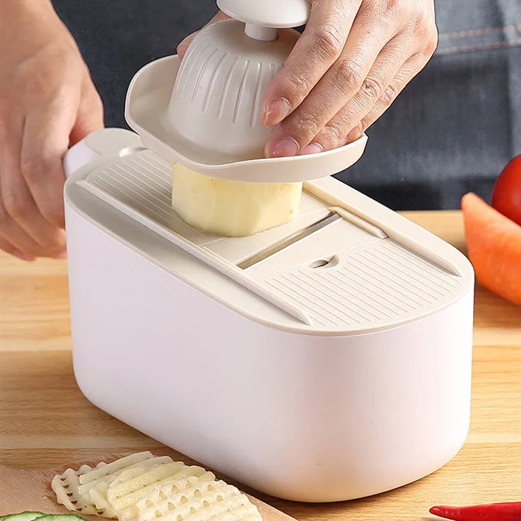 Nordic style multifunctional vegetable cutter with stainless steel blades in blue colour.