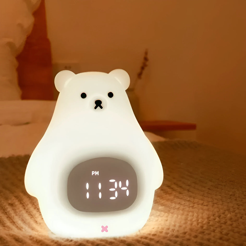 Big White Bear shaped silicone night light with colour-changing LED, showing remote control.