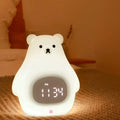 Big White Bear shaped silicone night light with colour-changing LED, showing remote control.