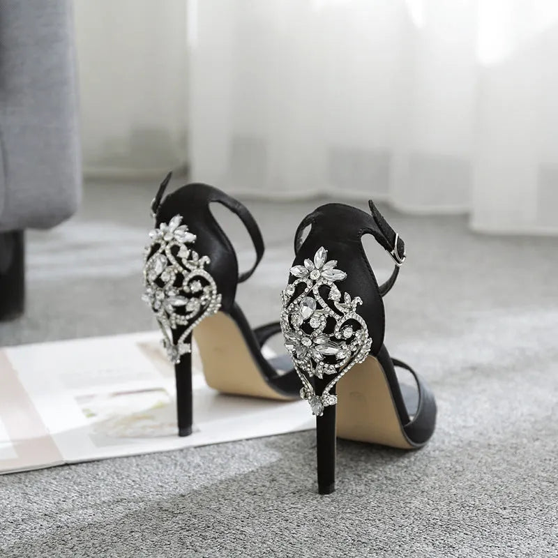 Black suede women's high heel shoes with glitter rhinestone decoration and a fish mouth open toe.