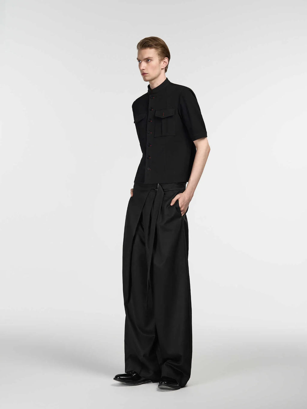 Black straight-leg trousers with adjustable waist and single pleat front in Tencel cotton blend fabric