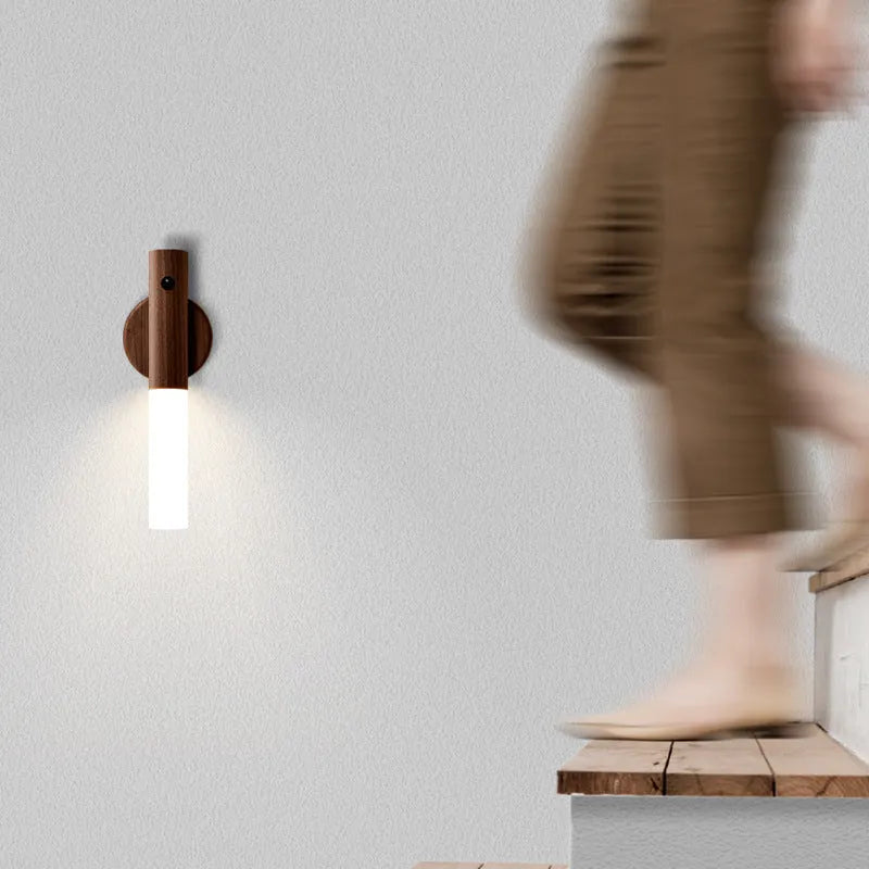 Wooden smart sensor LED desk lamp on a desk, showing compact size and simple design.