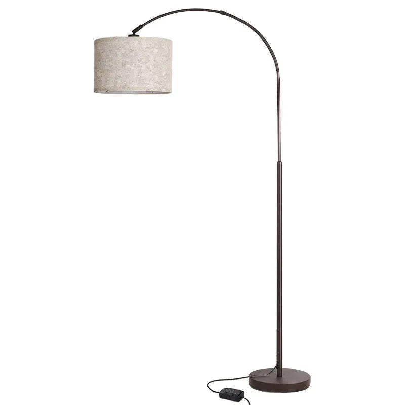 Modern minimalist fishing floor lamp with black fabric shade standing in a living room corner