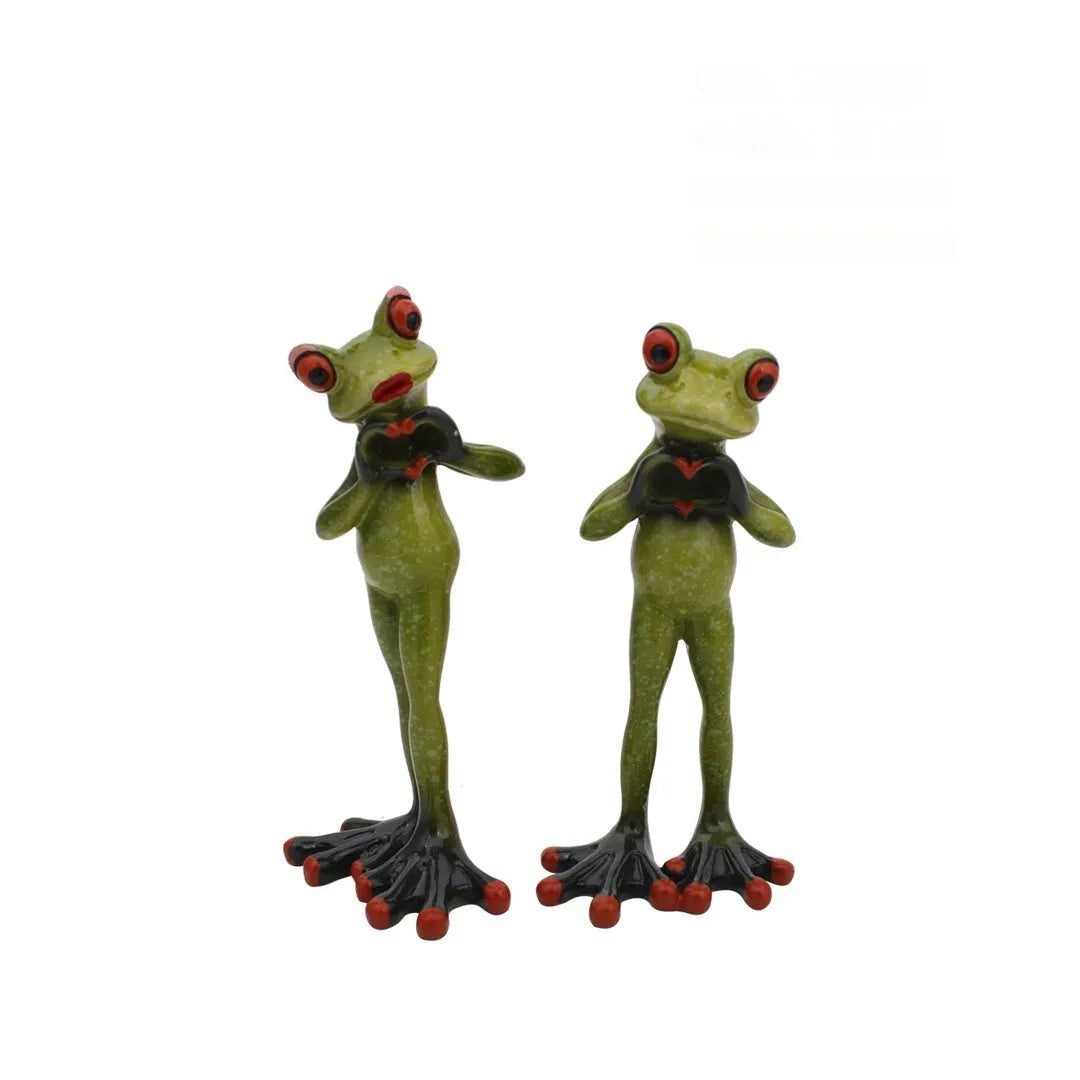 Pastoral style green resin frog decoration figurine on a wooden shelf.