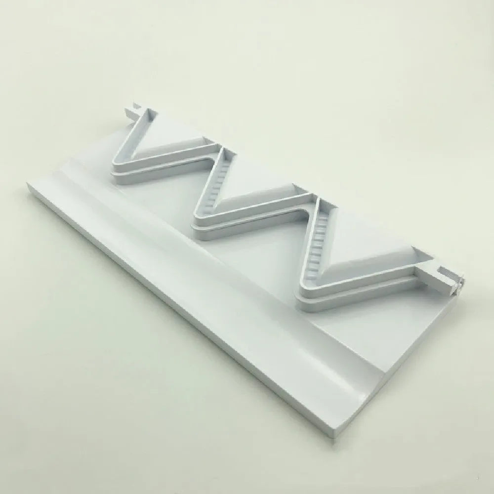 Pure white plastic dumpling maker 28.5cm length on a kitchen counter
