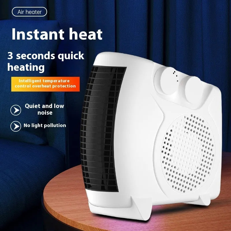 Small white portable electric heater with control dials on a desktop.