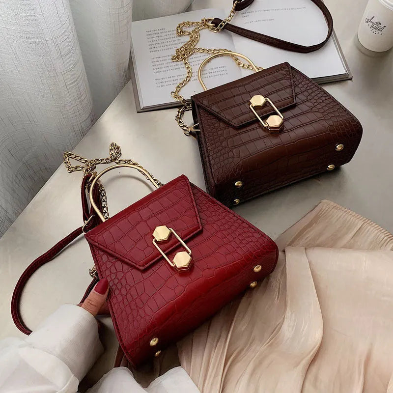 Small square PU shoulder messenger bag with zip, polyester lining, and internal pockets in black brown off white red