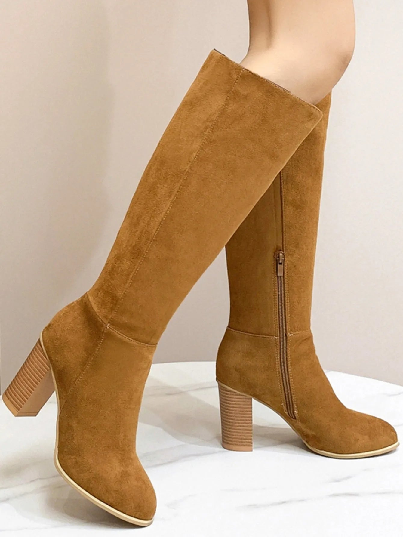 Women's square toe high heel fashion boots in black and dark brown colours showing front view