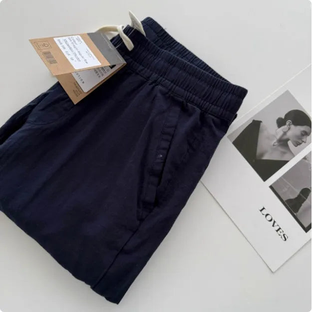 Men's loose straight leg casual trousers with drawstring waist in beige, black, green, grey, and navy blue colours