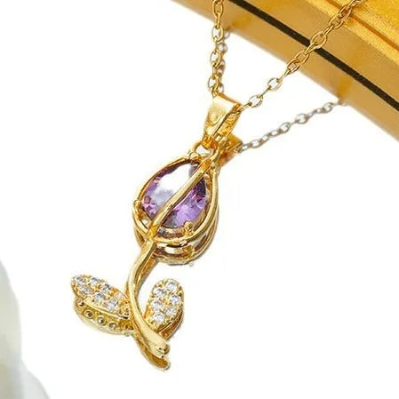 Gold-toned tulip flower zircon pendant on an adjustable O-ring chain necklace for women.