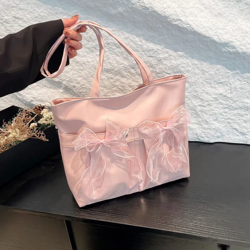 College style bow tote bag in PU leather with large capacity and internal zipper pocket organisation