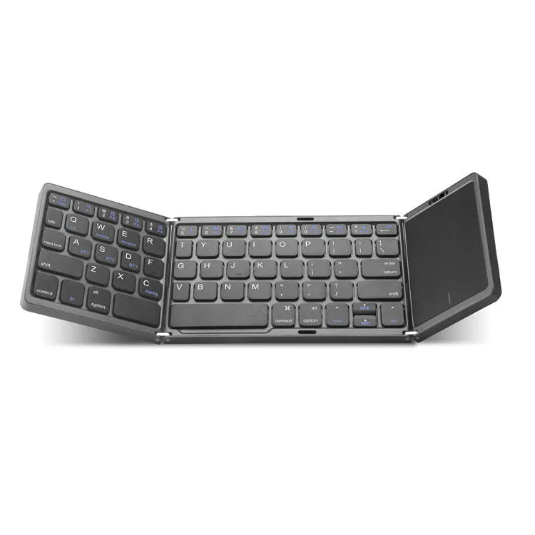 Three folding wireless Bluetooth keyboard with touch pad in black, open on a table next to a mobile phone