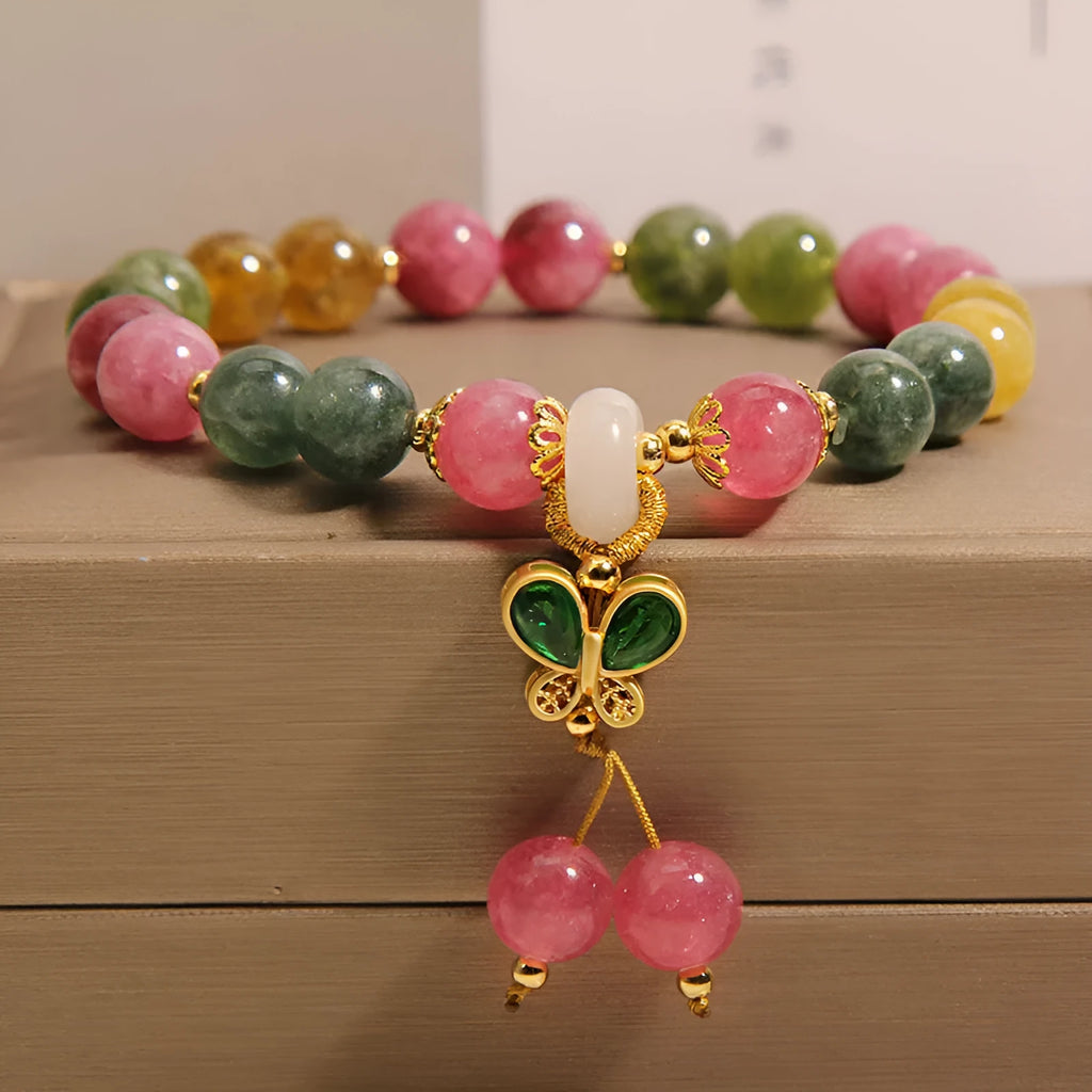 Women's tourmaline bracelet with colourful butterfly pendant and rhinestone detailing on adjustable chain