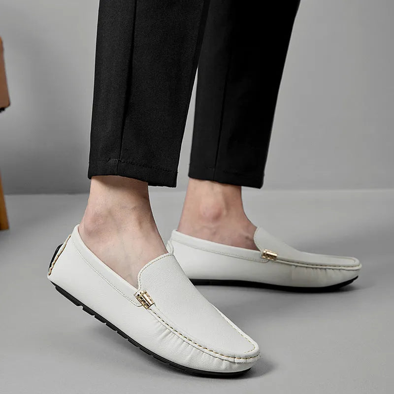 Men's driving shoes in black with matte leather finish, round toe, and flat wedge heel