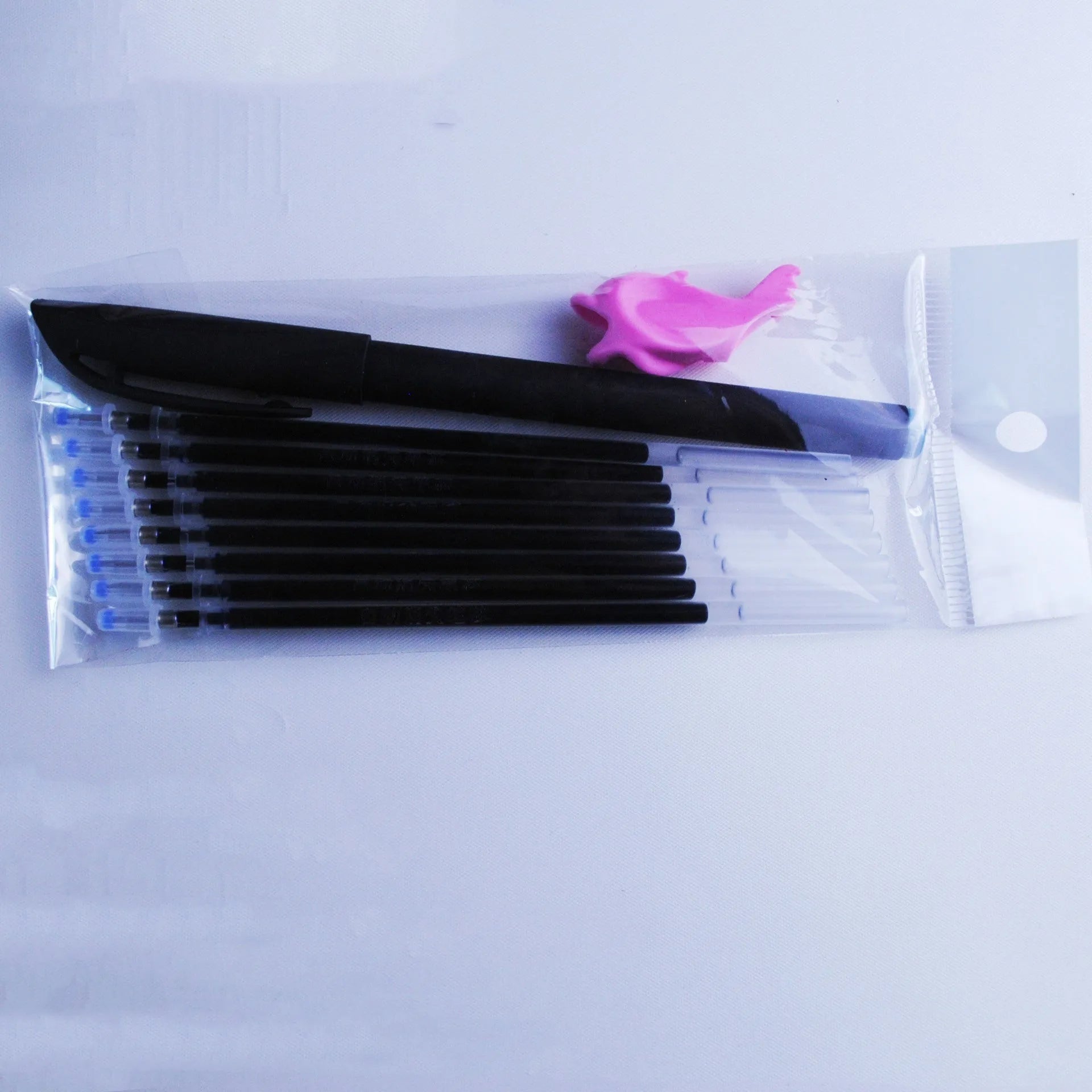 Portable fading ink pen set with 0.5mm tip, blue refills, and plastic body.