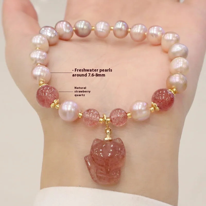 Women's light pink freshwater pearl bracelet with strawberry quartz beads and fox charm