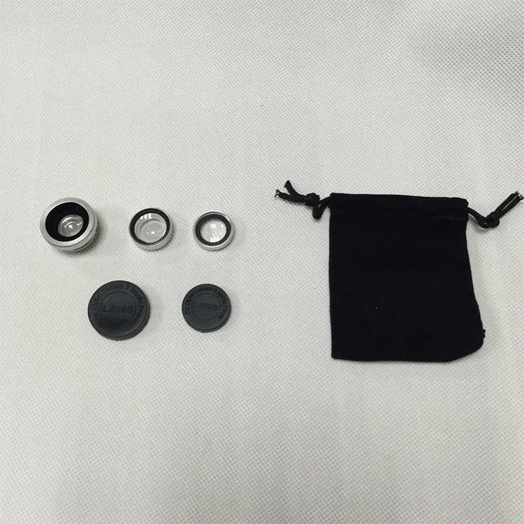 Three mobile phone lenses: fisheye, wide-angle, and macro in a photography accessory kit