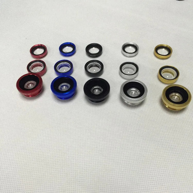 Three mobile phone lenses: fisheye, wide-angle, and macro in a photography accessory kit