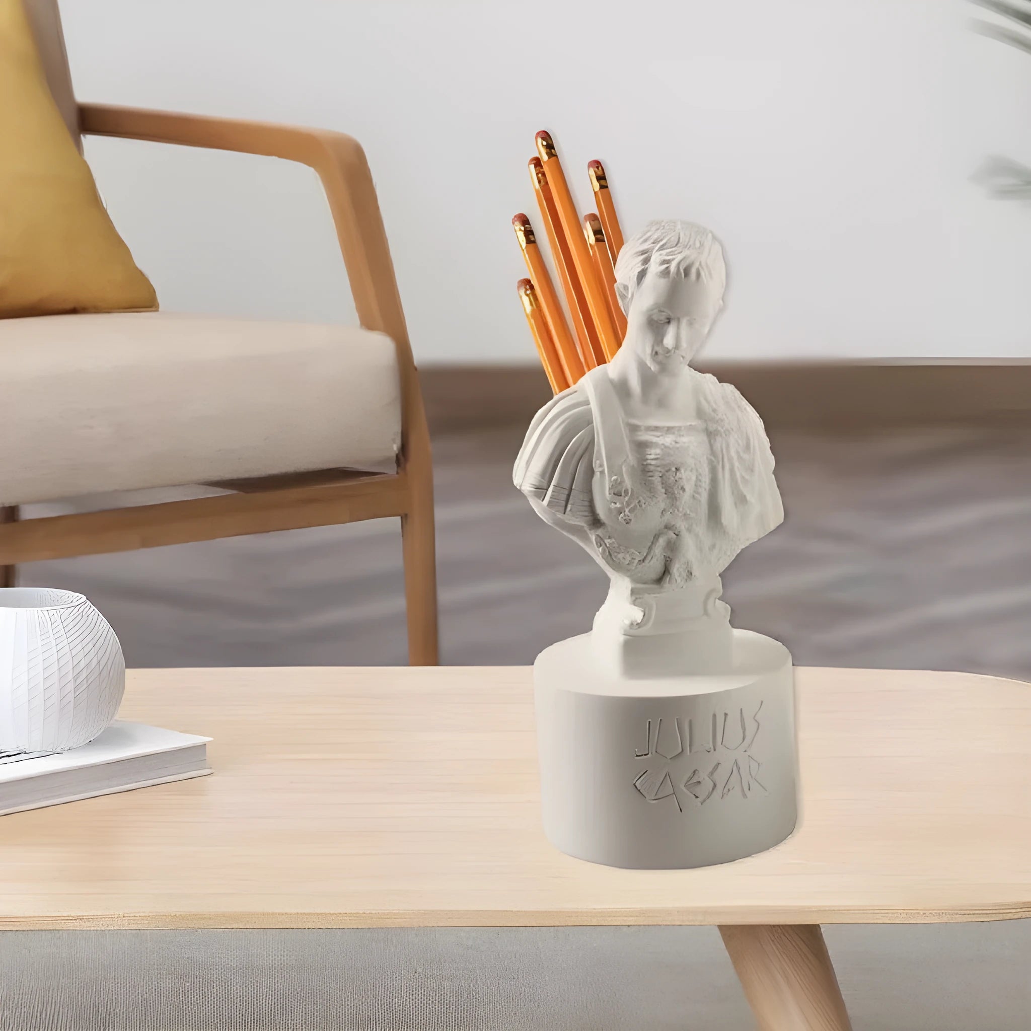 White synthetic resin pen holder with American creative character modelling on a desk.