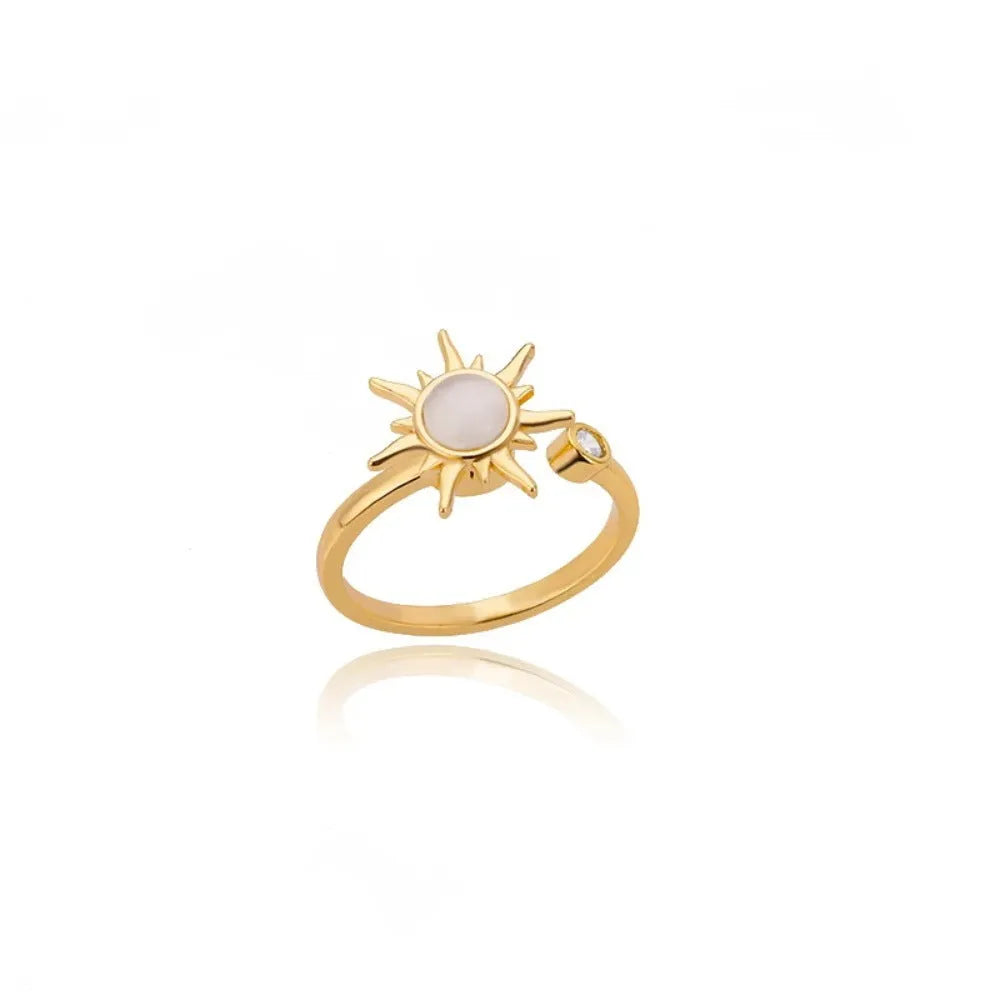 Adjustable decompression ring with rotatable band in gold or platinum finish