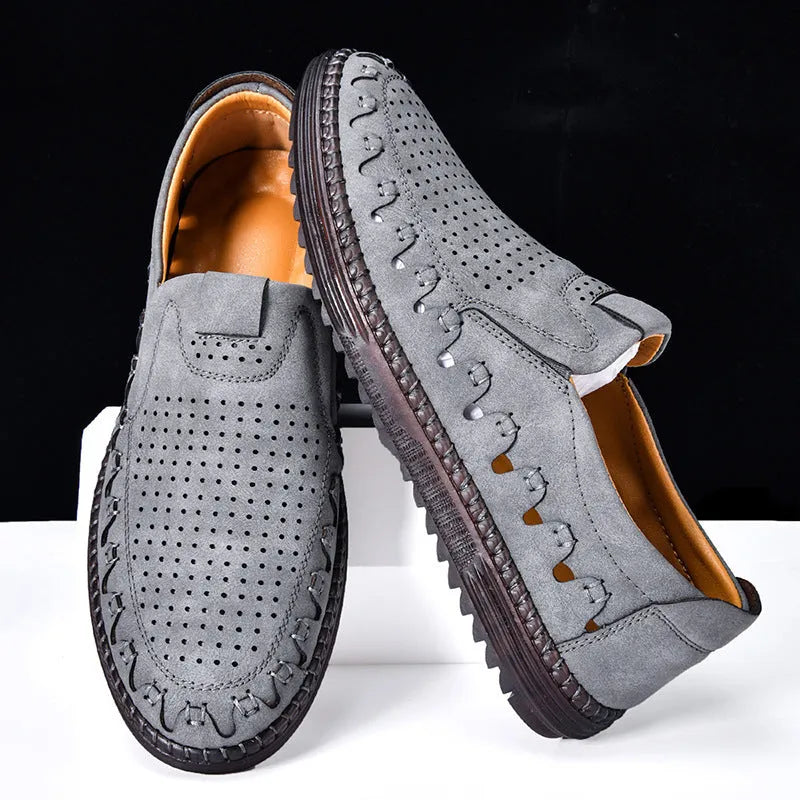 Men's brown slip-on casual shoes with round toe, sewing line detail, and flat PVC sole.