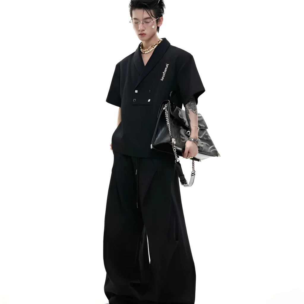 Men's dark grey V-neck cotton sports suit jacket with padded shoulders and matching shorts.