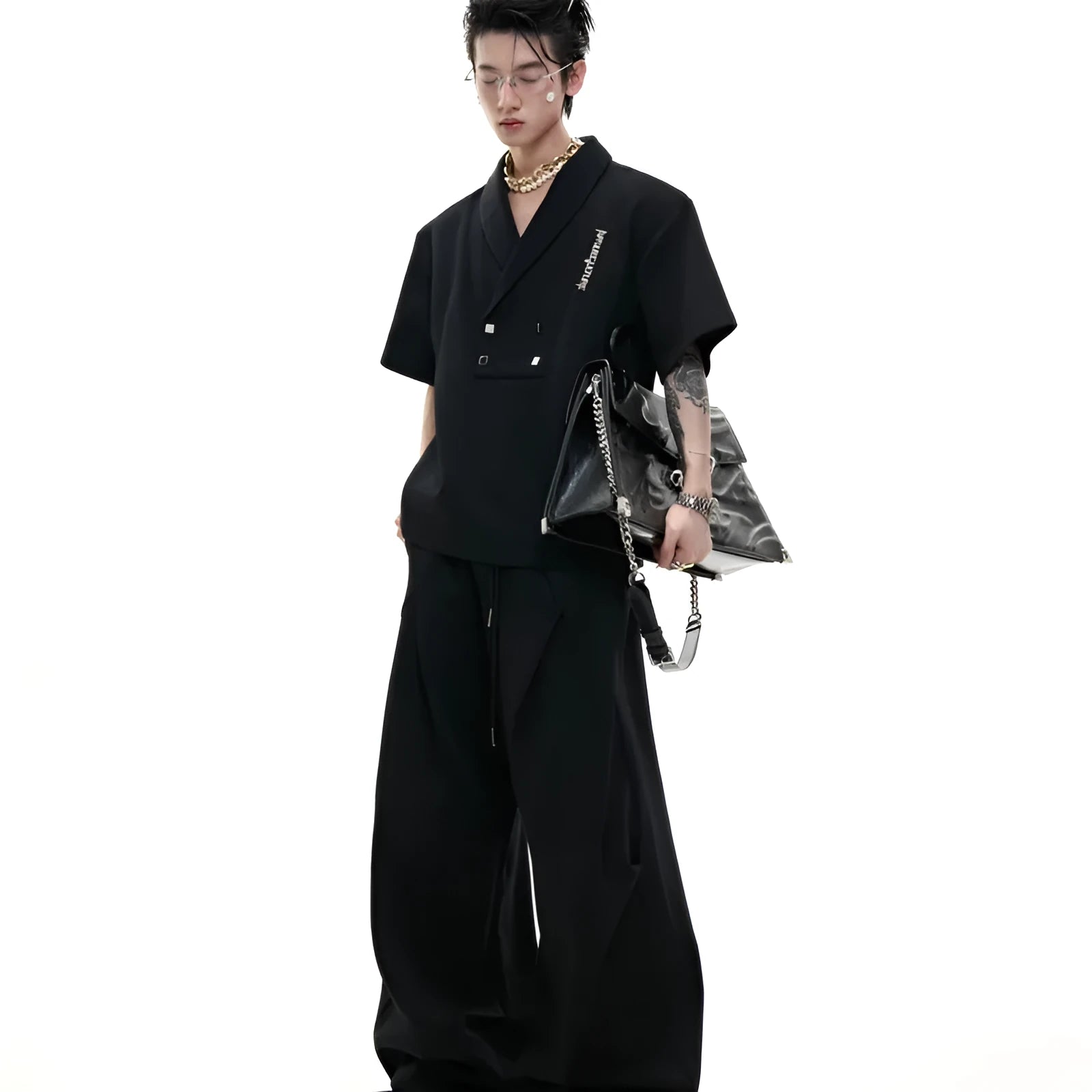 Men's dark grey V-neck cotton sports suit jacket with padded shoulders and matching shorts.