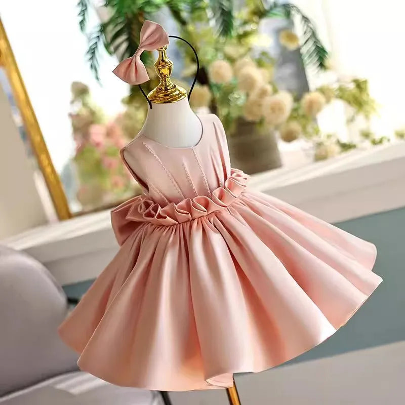 Children's princess dress in flesh pink polyester for piano performance with full skirt and fitted bodice