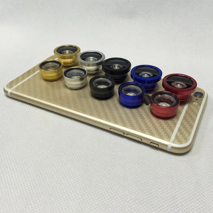 Three mobile phone lenses: fisheye, wide-angle, and macro in a photography accessory kit