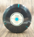 AC automatic sweeping robot vacuum cleaner in black or white on a hard floor