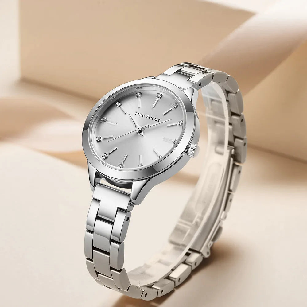 Women's 34mm solid steel strap quartz watch with rhinestone accents, blue dial, alloy case, 3ATM water-resistant