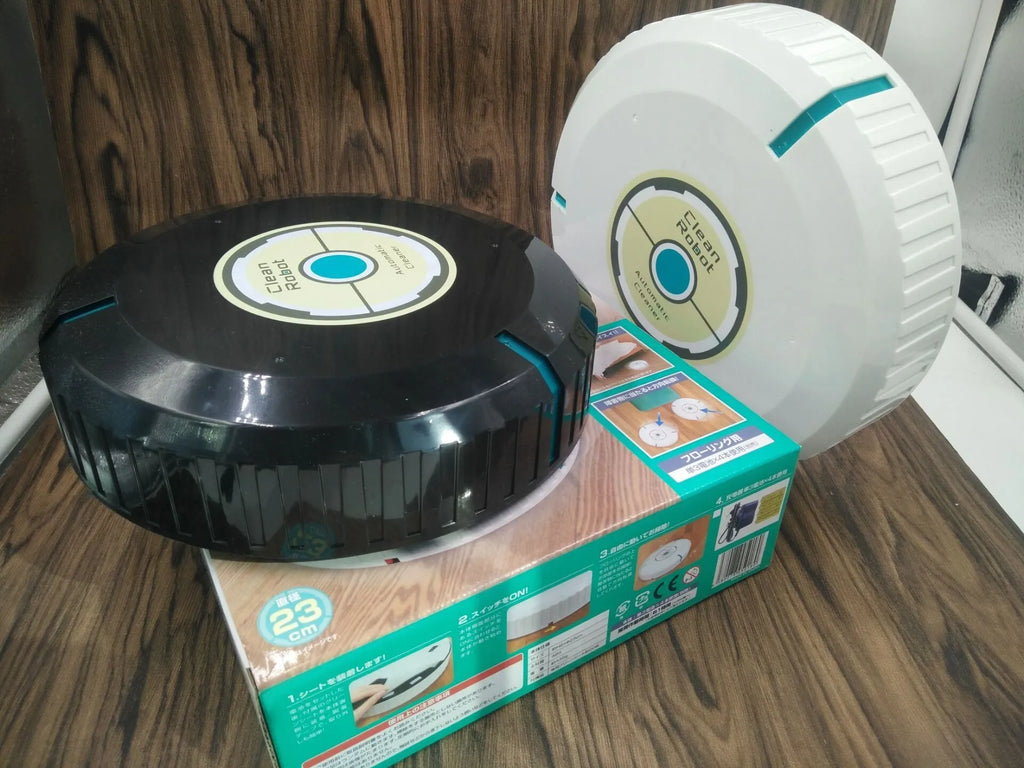 AC automatic sweeping robot vacuum cleaner in black or white on a hard floor