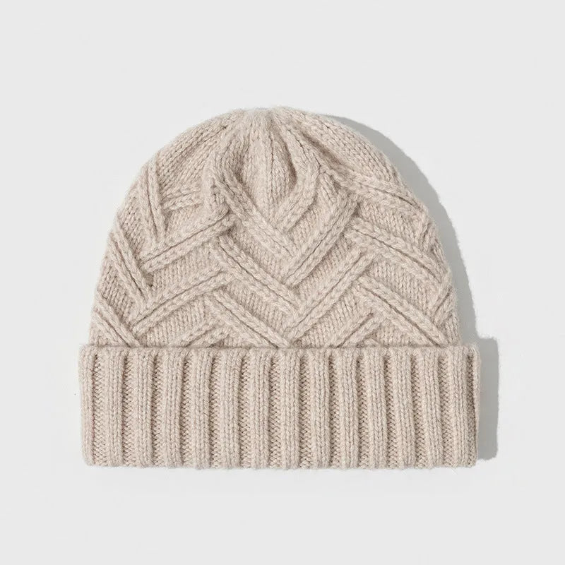 A woman's wool knitted winter hat in a dome crown style, shown in ankela red colour.