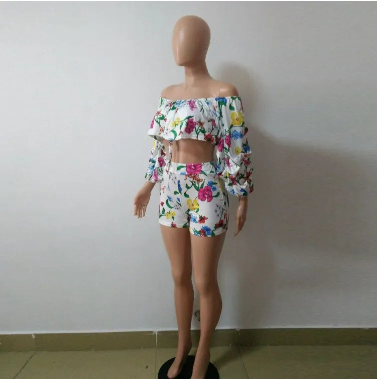 Women's multicolour digital print lounge set with puff-sleeved top and shorts.