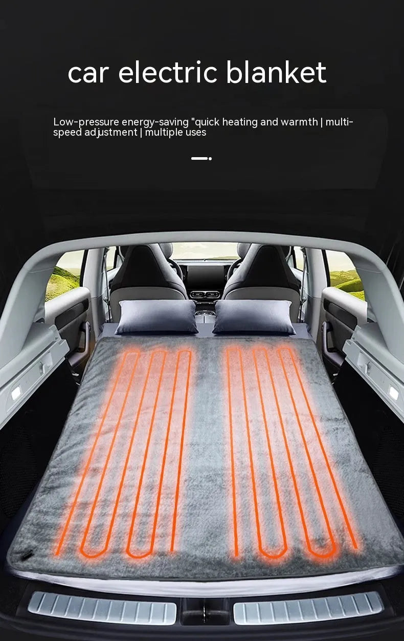 Grey 12V car electric blanket showing cigarette lighter plug connection and temperature controls