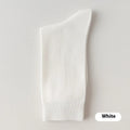 Mid-calf solid colour business socks for men in combed cotton, shown in a range of colours including army green and black.