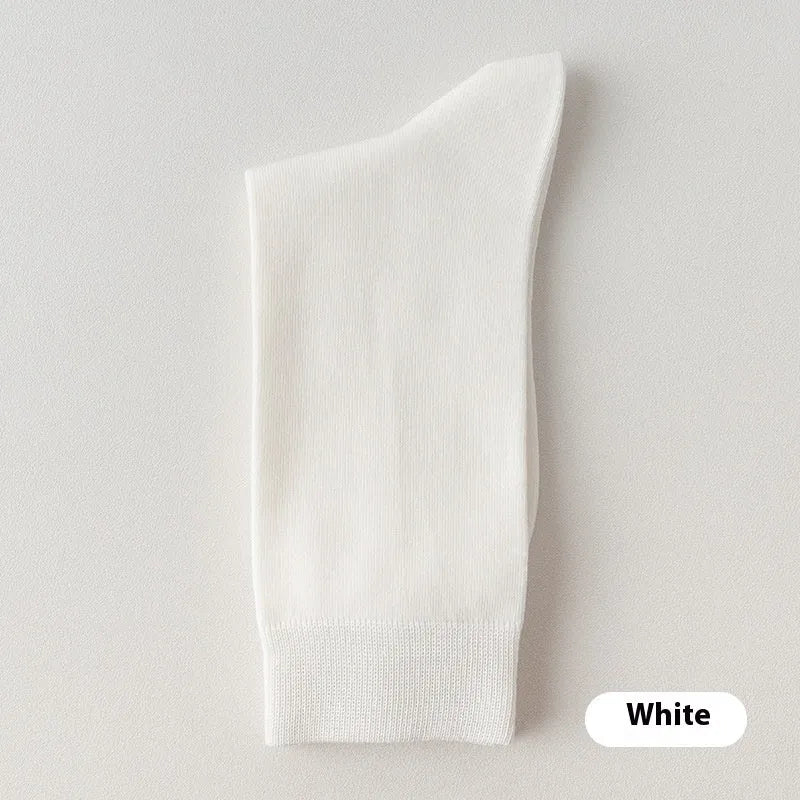 Mid-calf solid colour business socks for men in combed cotton, shown in a range of colours including army green and black.