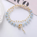 Natural freshwater pearl and crystal double ring bracelet in amethyst, aquamarine, or strawberry quartz colours