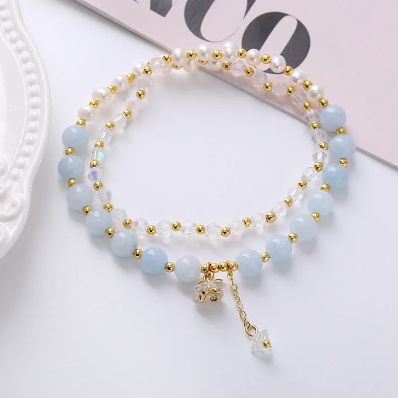 Natural freshwater pearl and crystal double ring bracelet in amethyst, aquamarine, or strawberry quartz colours