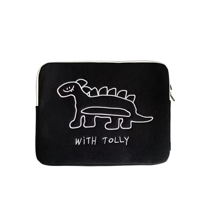 Embroidered animal design laptop sleeve in polyester, shown next to a laptop.